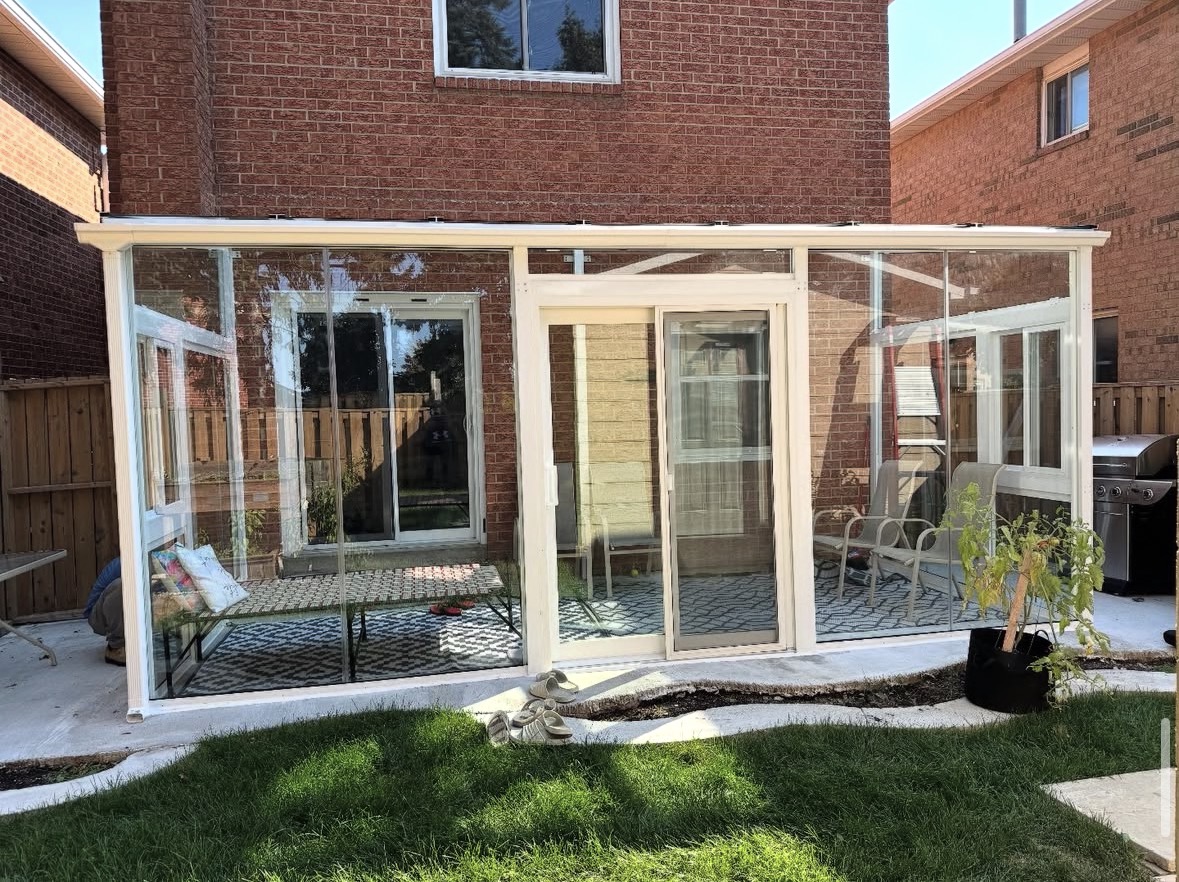 White-framed sunroom on patio
