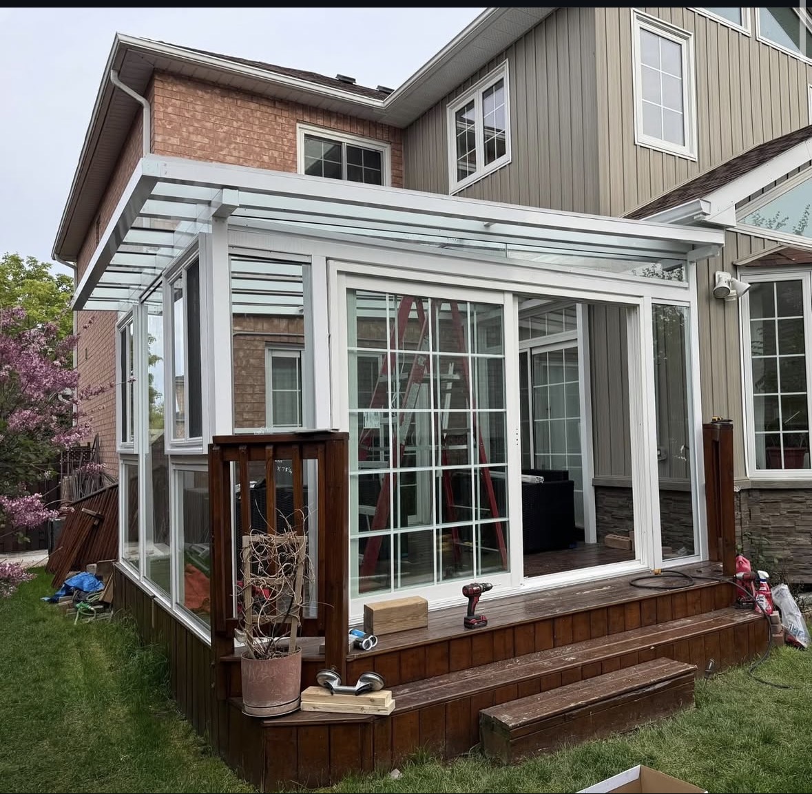 White sunroom on deck under construction
